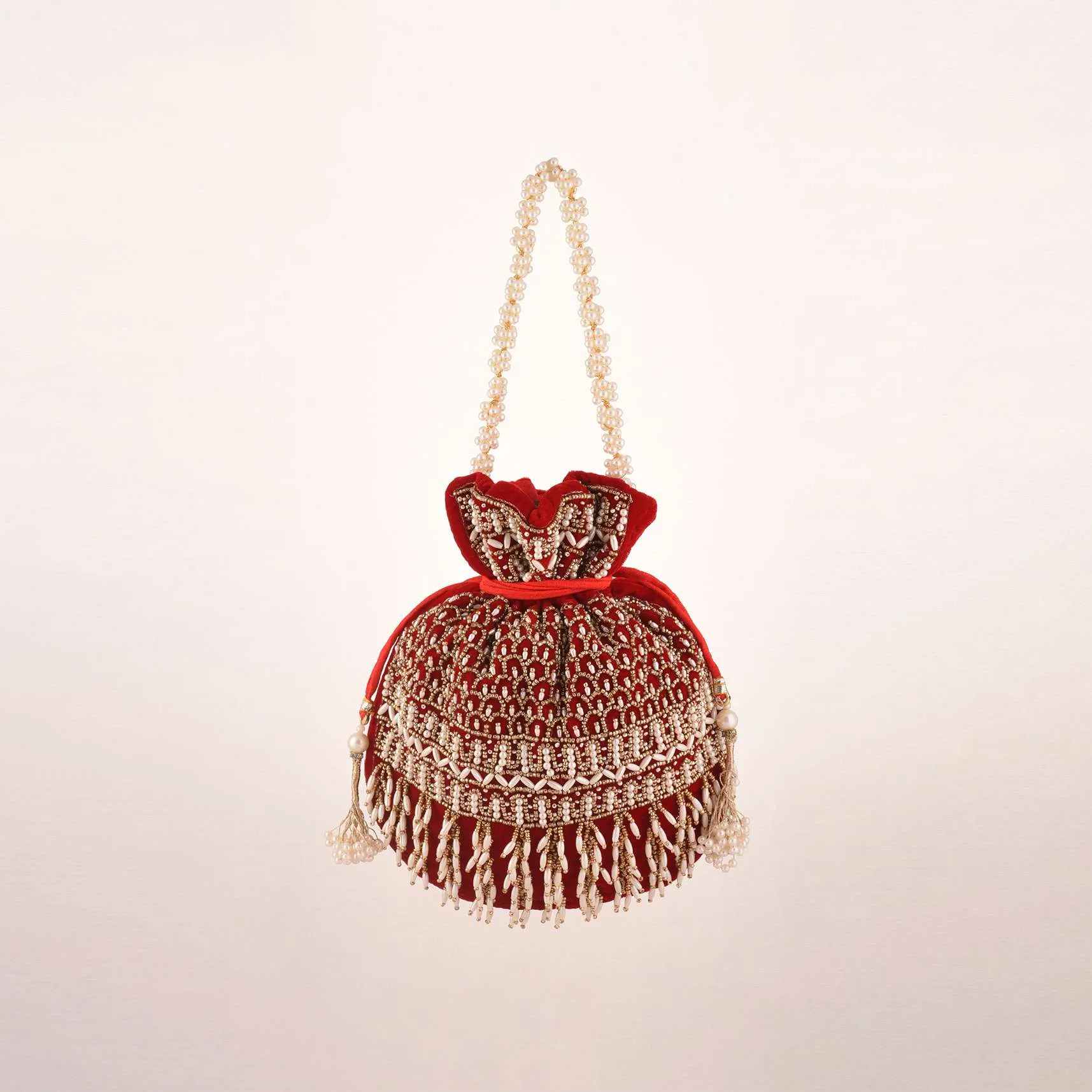 Cherry Red Potli In Velvet Heavily Embroidered With Beads And Moti Work In Scalloped And Tassel