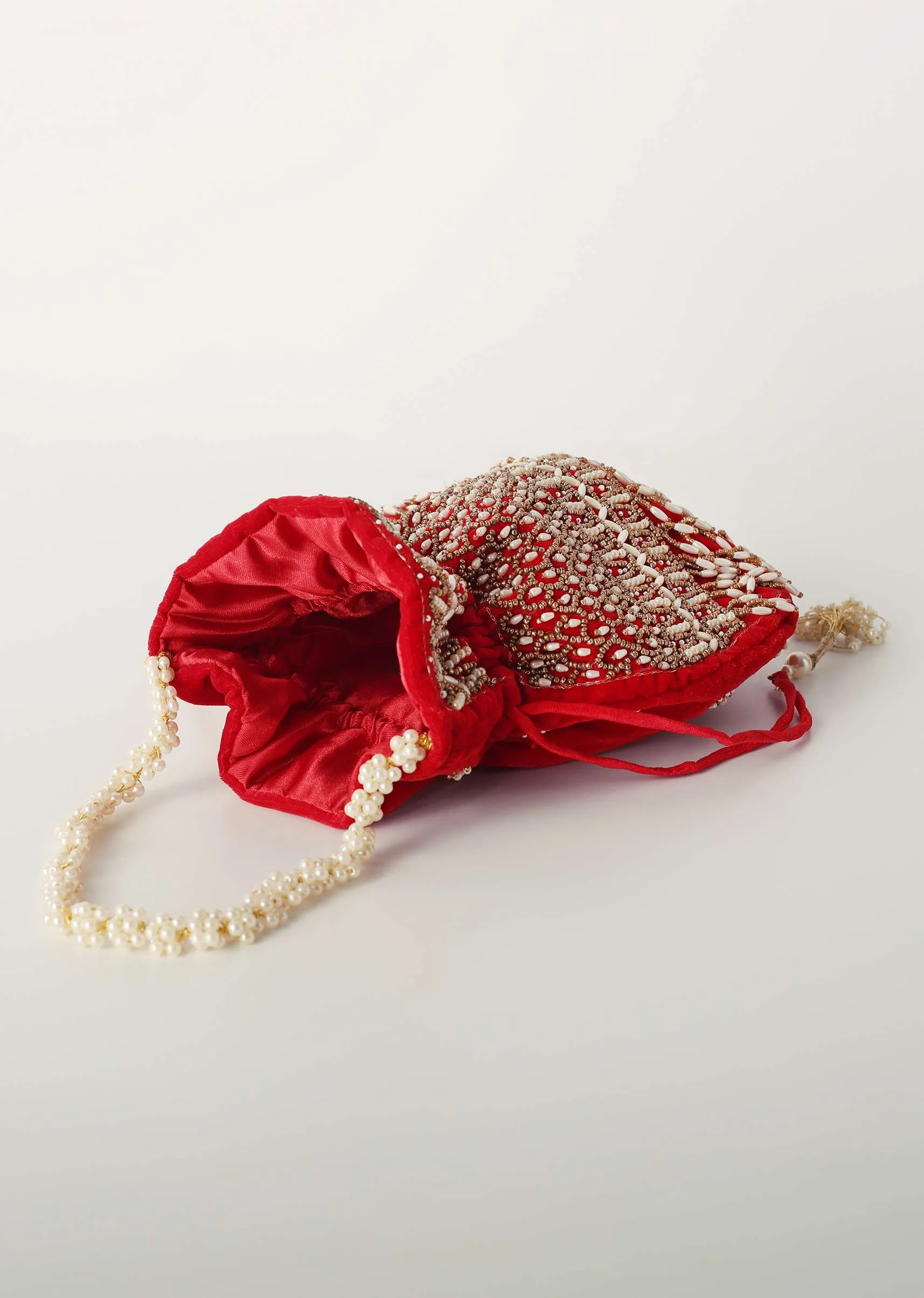 Cherry Red Potli In Velvet Heavily Embroidered With Beads And Moti Work In Scalloped And Tassel