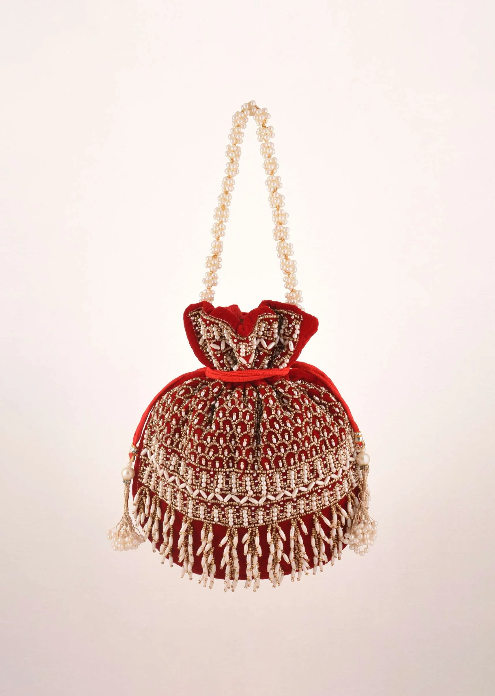 Cherry Red Potli In Velvet Heavily Embroidered With Beads And Moti Work In Scalloped And Tassel