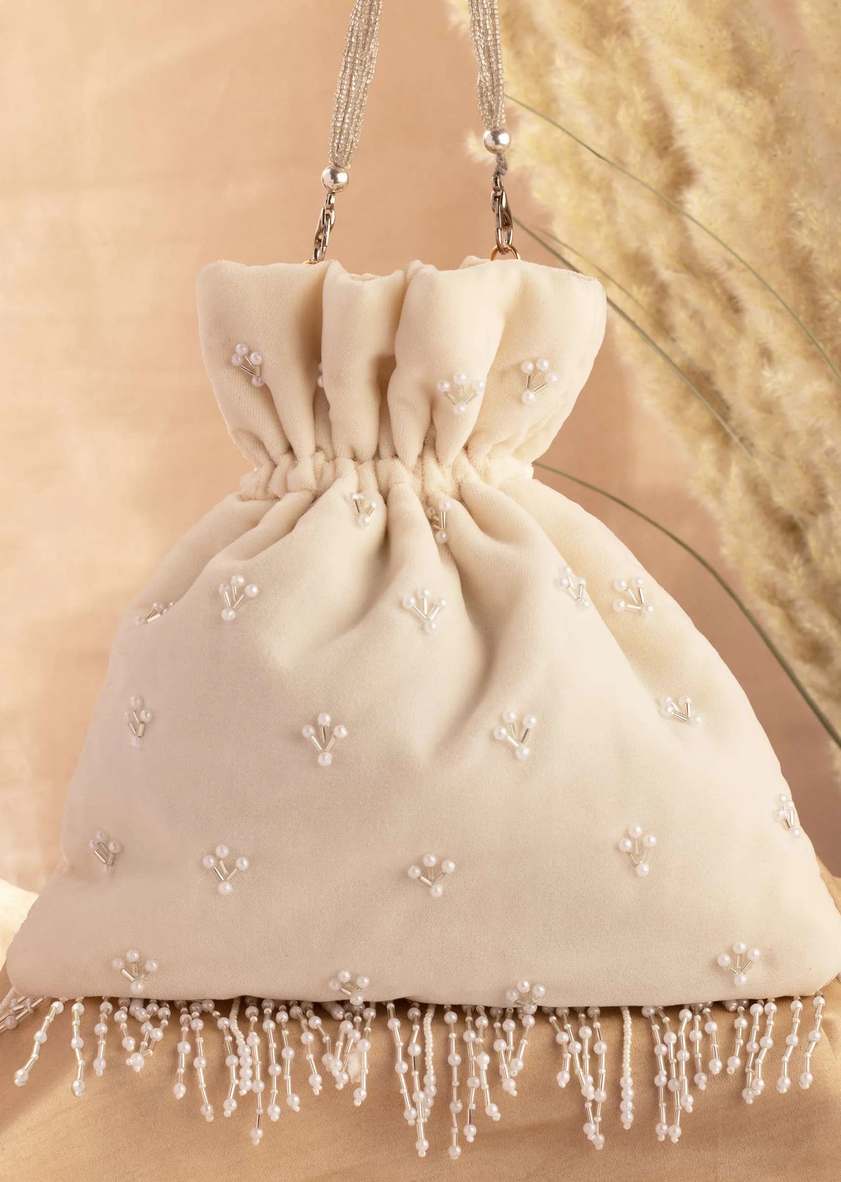 Ivory White Hand Embroidered Potli In Velvet